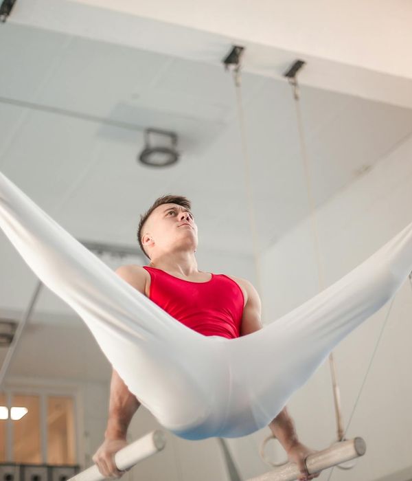 Man performing a controlled strength exercise with focus and precision.